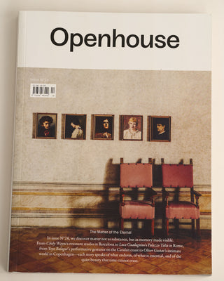 Magazine 'Openhouse' Issue N 24 with scene of a room with framed portraits and a chair on a marble background